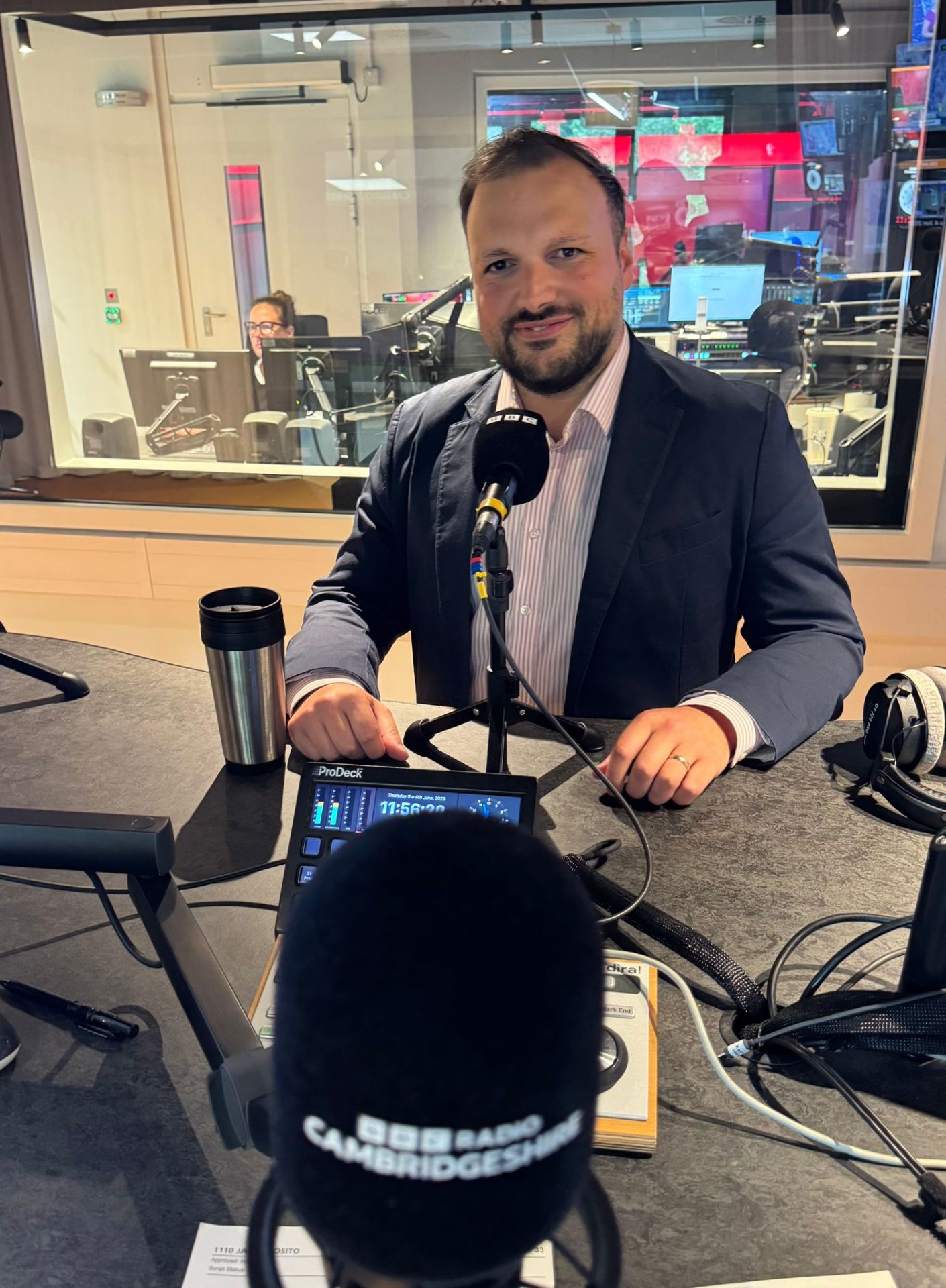 Jack from Cambridge Food behind the BBC Radio Cambridgeshire microphone