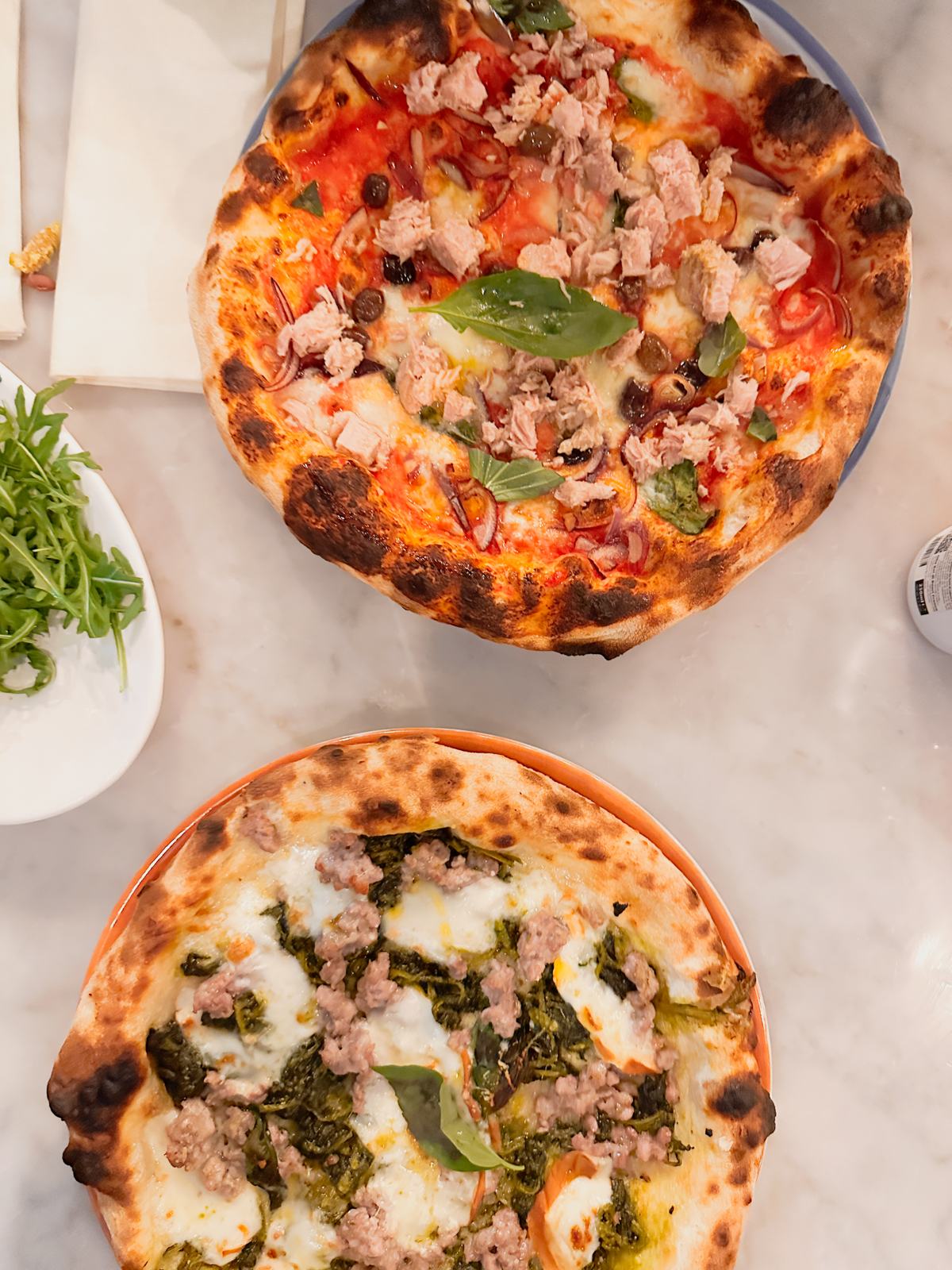 Two Neapolitan pizzas with puffy, blistered crusts at Salento in Marleigh, Cambridge.
